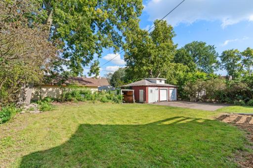 This rear garage is accessible via a gate and curb cut.