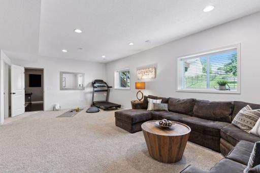 Lower level family room toward space currently used as exercise area.