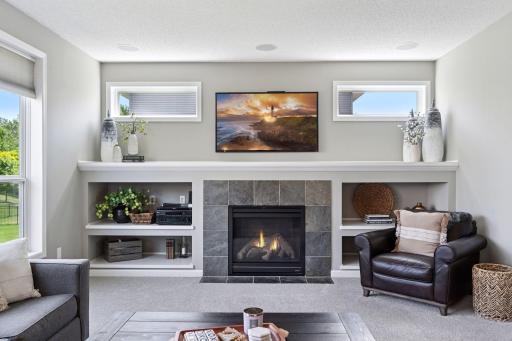 Gas fireplace is so convenient and the neutral slate surround is timeless.