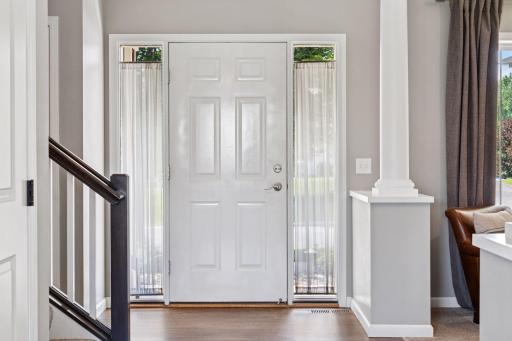 Light and bright throughout, this home offers an inviting front foyer.