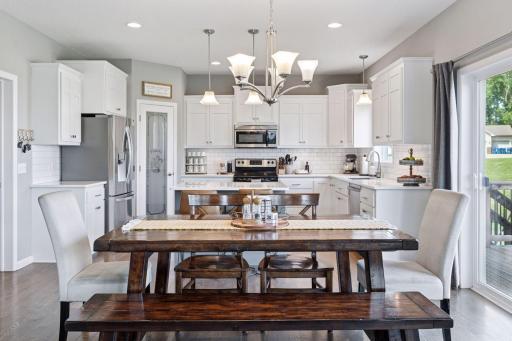 Spacious dining room is open to kitchen, family room and access to large cedar deck with stairway to back yard.