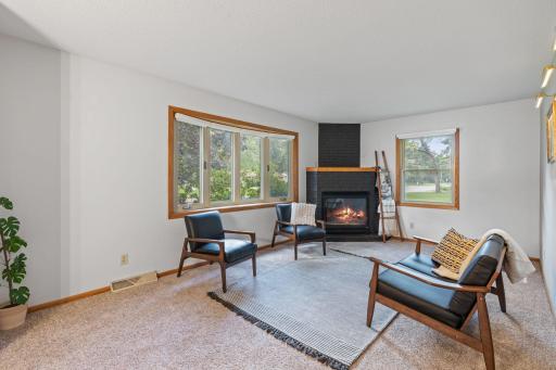 Living Room features gas fireplace and gallery wall lighting