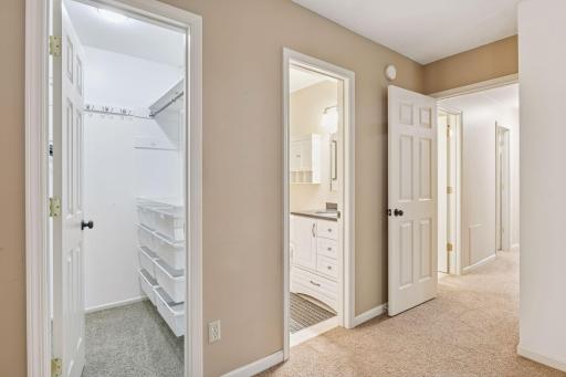 Primary bedroom features an ensuite half-bath and walk-in closet.