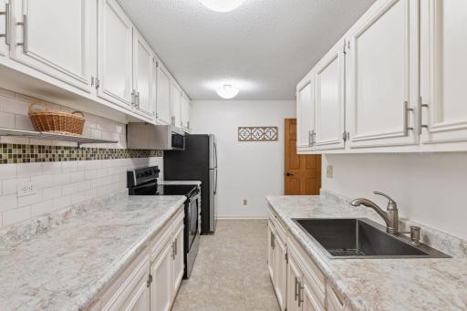 Kitchen provides a nice amount of workspace and storage for those who like to cook.