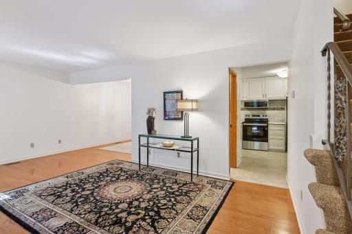 Oak flooring through the living room and dining area.