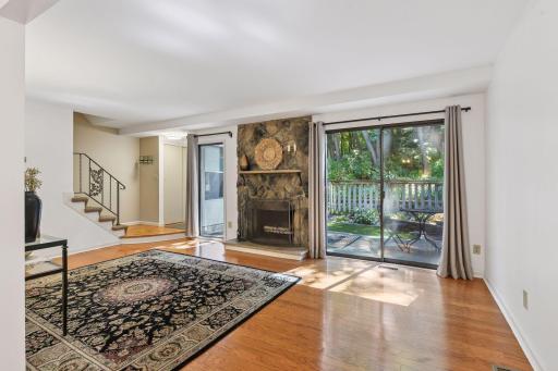 Fireplace and sliding glass door out to the patio.