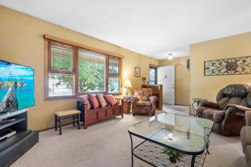 Large, newer window. 2 double hung either side of picture window