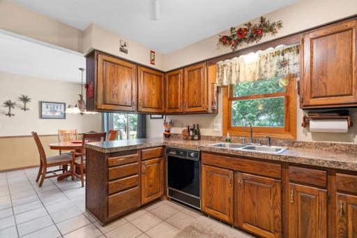 Raised panel Oak cabinet doors and tile floor