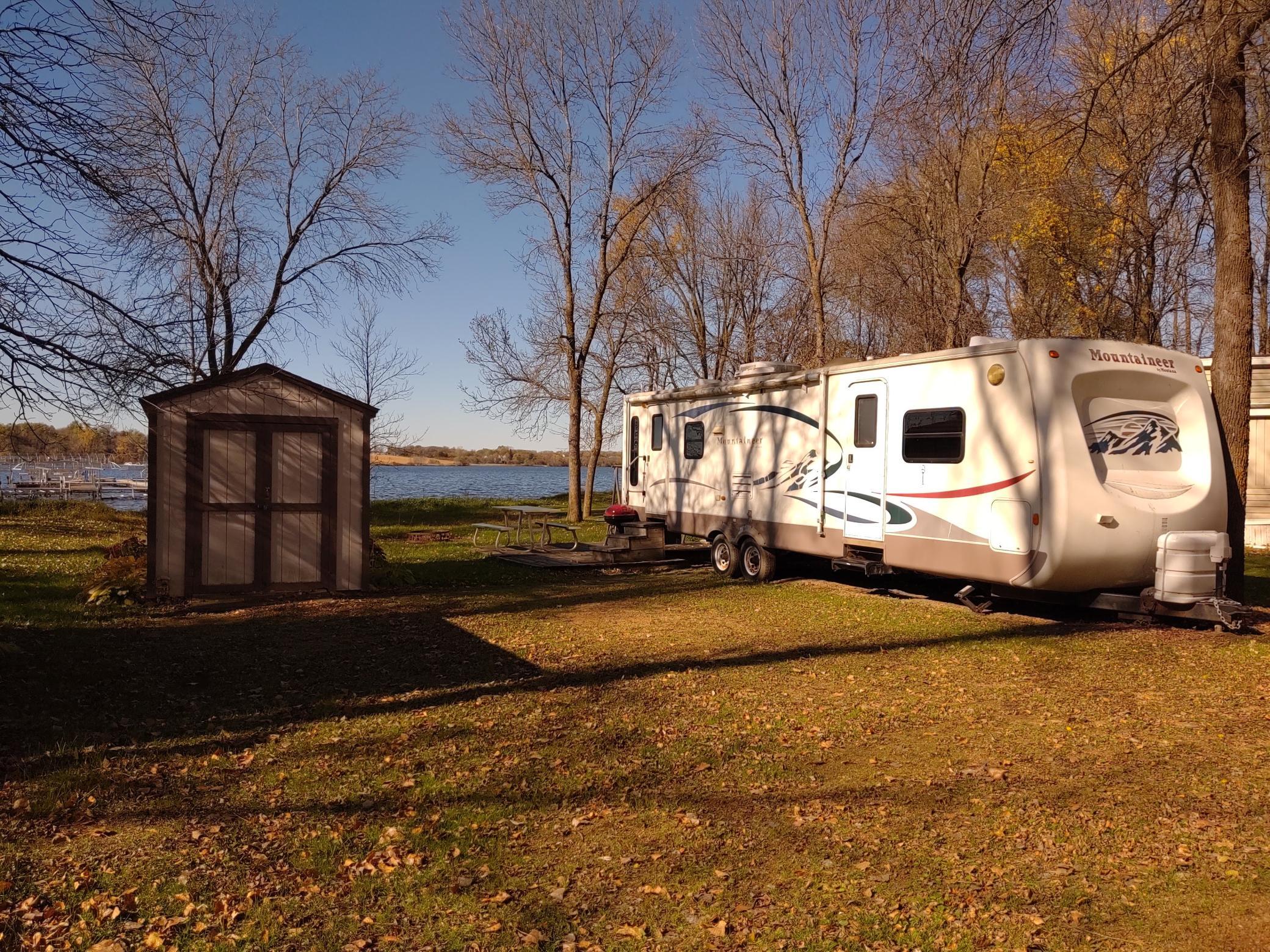 Placed near lake with shed to house golf cart, this is a turn-key unit ready for your enjoyment!