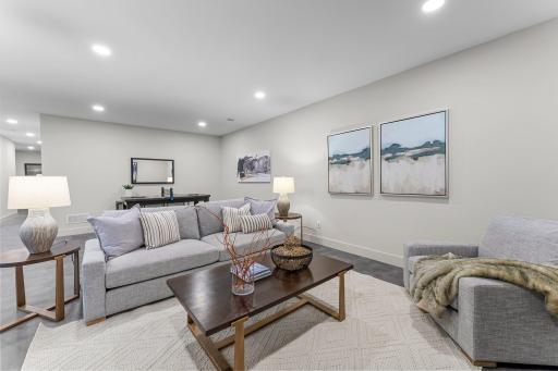 With durable LVP flooring and recessed lighting, it is an ideal space for hosting gatherings or enjoying movie nights.