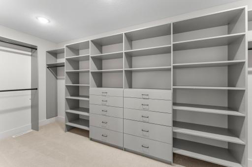 Included is a spacious 17 by 7 walk-in closet with custom shelving for optimal organization.