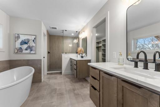 The private en suite bathroom is designed for relaxation.
