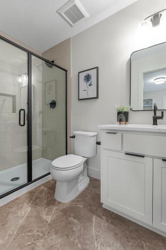 It has its own private Â¾ bathroom with a tile walk-in shower and single vanity.