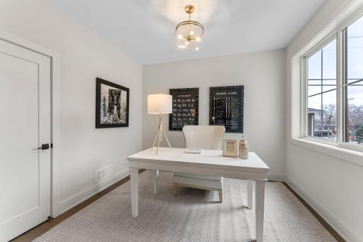A versatile den near the front of the home features pocket doors, a closet for extra organization, and a large window overlooking the front yardâideal for a home office, study, or additional living space.
