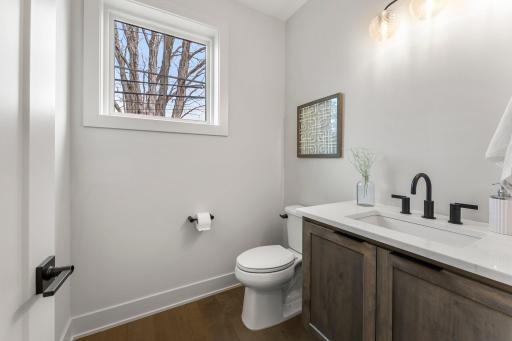 Just off the entryway, a convenient half bathroom offers added functionality.