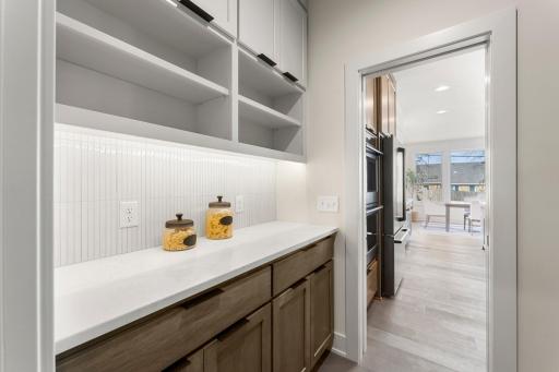 It includes a walk-through pantry/buffet counter area measuring 8 by 5 feet.