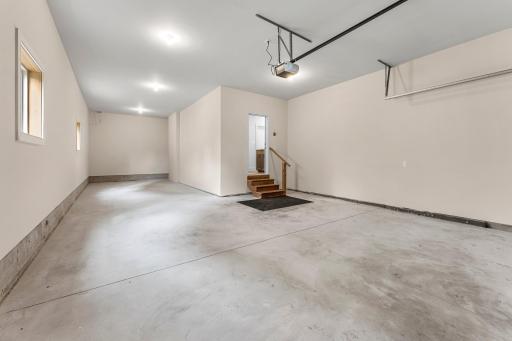 The garage includes a remote-opened door and a tandem stall extending 43 feet.