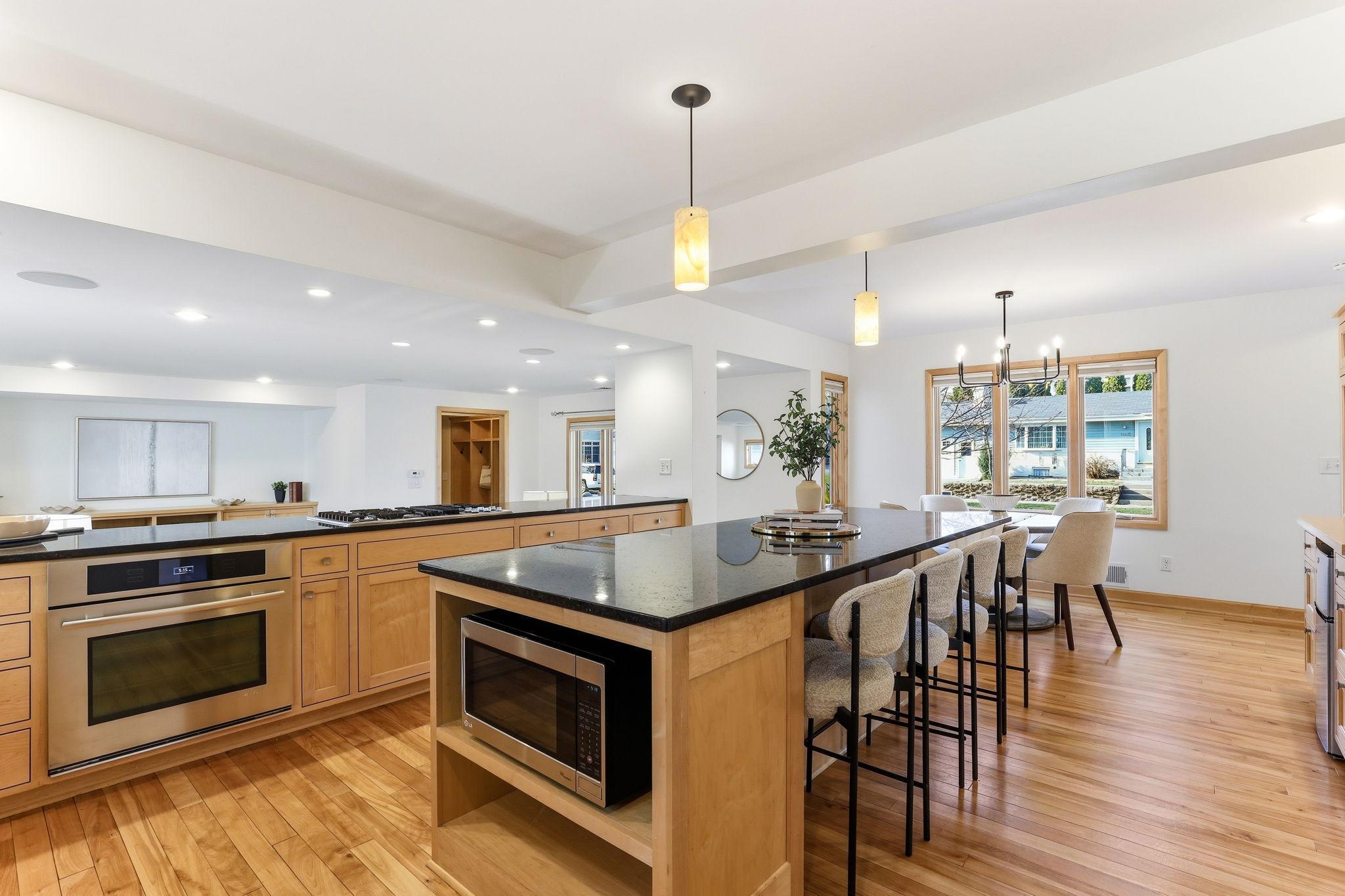 30-weKitchen with natural wood cabinets and granite countertopsb-or-mls-5300-Logan-Ave-S-30.jpg