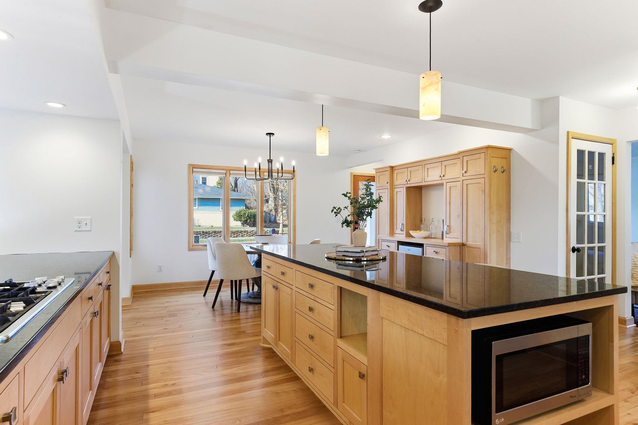 Kitchen with natural wood cabinets and granite countertops