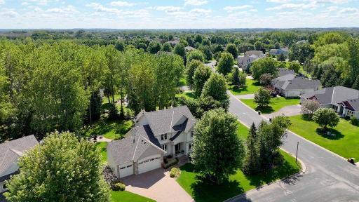 Large corner lot with mature trees and beautiful landscaping