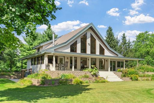 Welcome to your private retreat in Ham Lake—an extraordinary 12.3-acre estate where modern living and natural beauty meet.