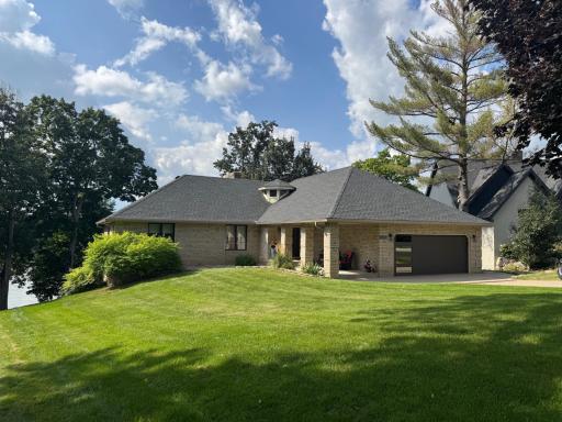This beautifully walk-out rambler is perfectly situated on the tranquil shores of Upper Prior Lake. The home blends luxurious indoor comfort with breathtaking outdoor scenery, offering panoramic lake views, gorgeous sunsets & direct water access.