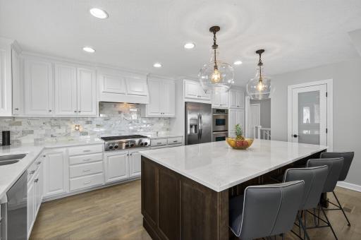 At the heart of the home is the remodeled kitchen, crafted with both function and style in mind.