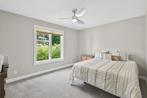 One of the inviting bedrooms on the main floor offers a bright and comfortable retreat.