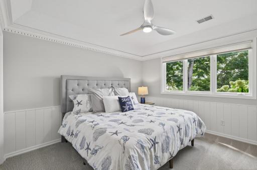 The lower level includes two additional bedrooms, each offering generous closet space & natural light.