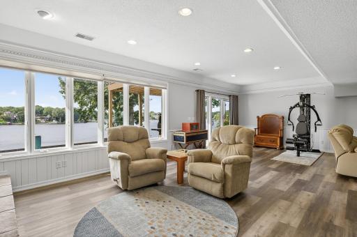 The walk-out lower level extends your living space with a spacious family room with a wood burning fireplace, perfect for relaxing or gathering with guests.
