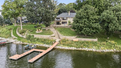 Additional improvements include refinished hardwood floors, fresh interior paint throughout, new carpet on both levels, LVP flooring in the lower level, a new Bosch dishwasher, water softener, and a new furnace installed in 2021.
