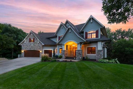 5,802 finished sq. ft. on a private 0.33-acre wooded cul-de-sac lot overlooking Riley Creek