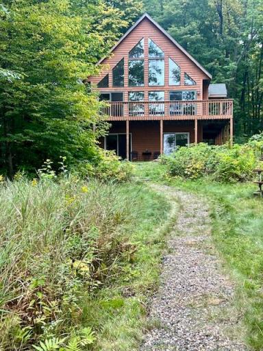 Pics are snapshots to get the home on the market before the weekend. Stop back for professional photos and more details. Cedar siding portrays the rustic feel of Northwestern Wisconsin