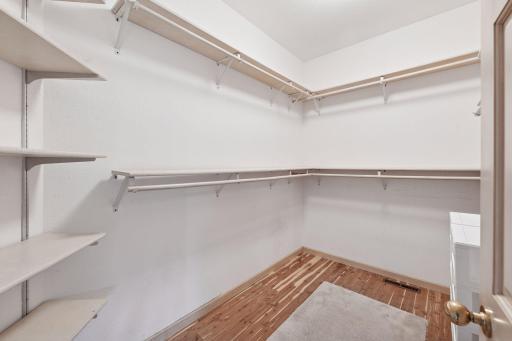 Spacious primary bedroom walk-in closet.