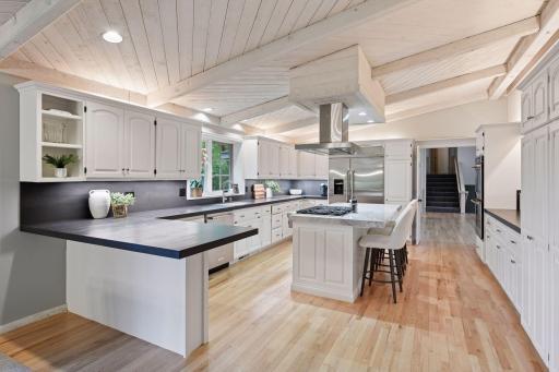 Beautiful kitchen with lots of counter and storage space - along with plenty of room to sit around and entertain