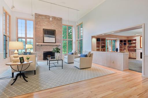 Beautiful wood floors and soaring ceilings create a bright, open living space
