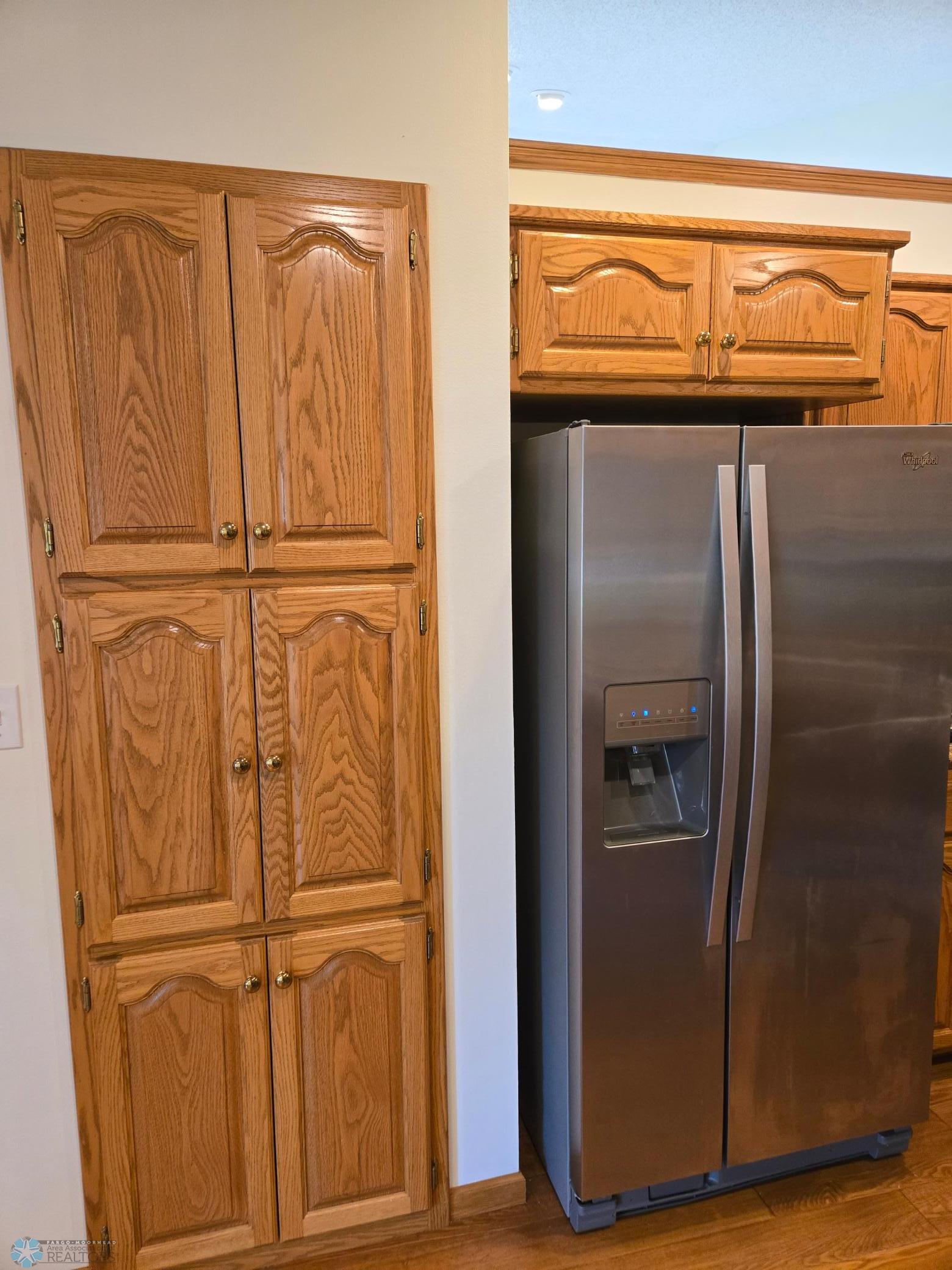 Kitchen Stainless Steel Frig and Shelving.jpg
