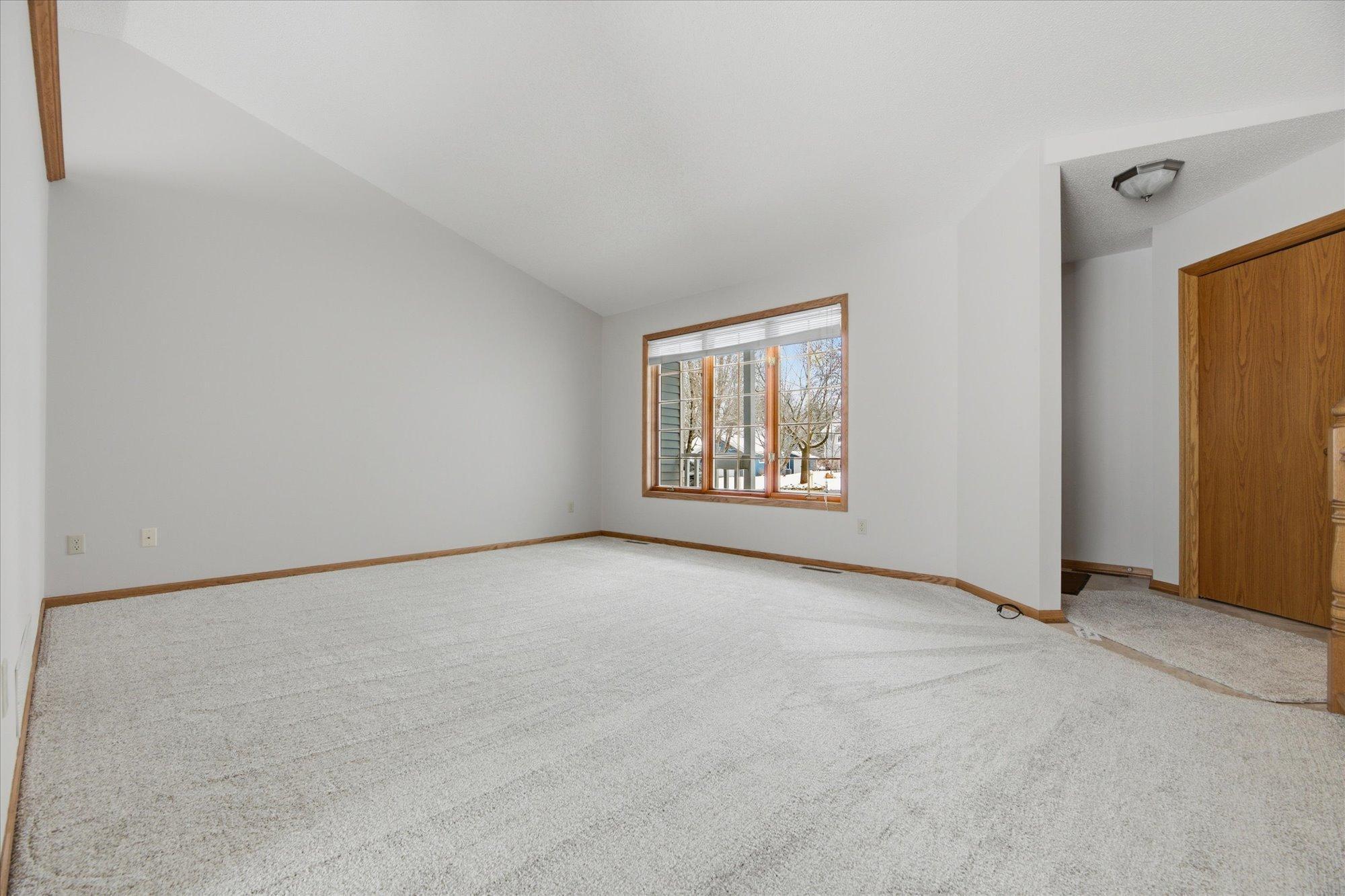 Bright open living room overlooking front yard