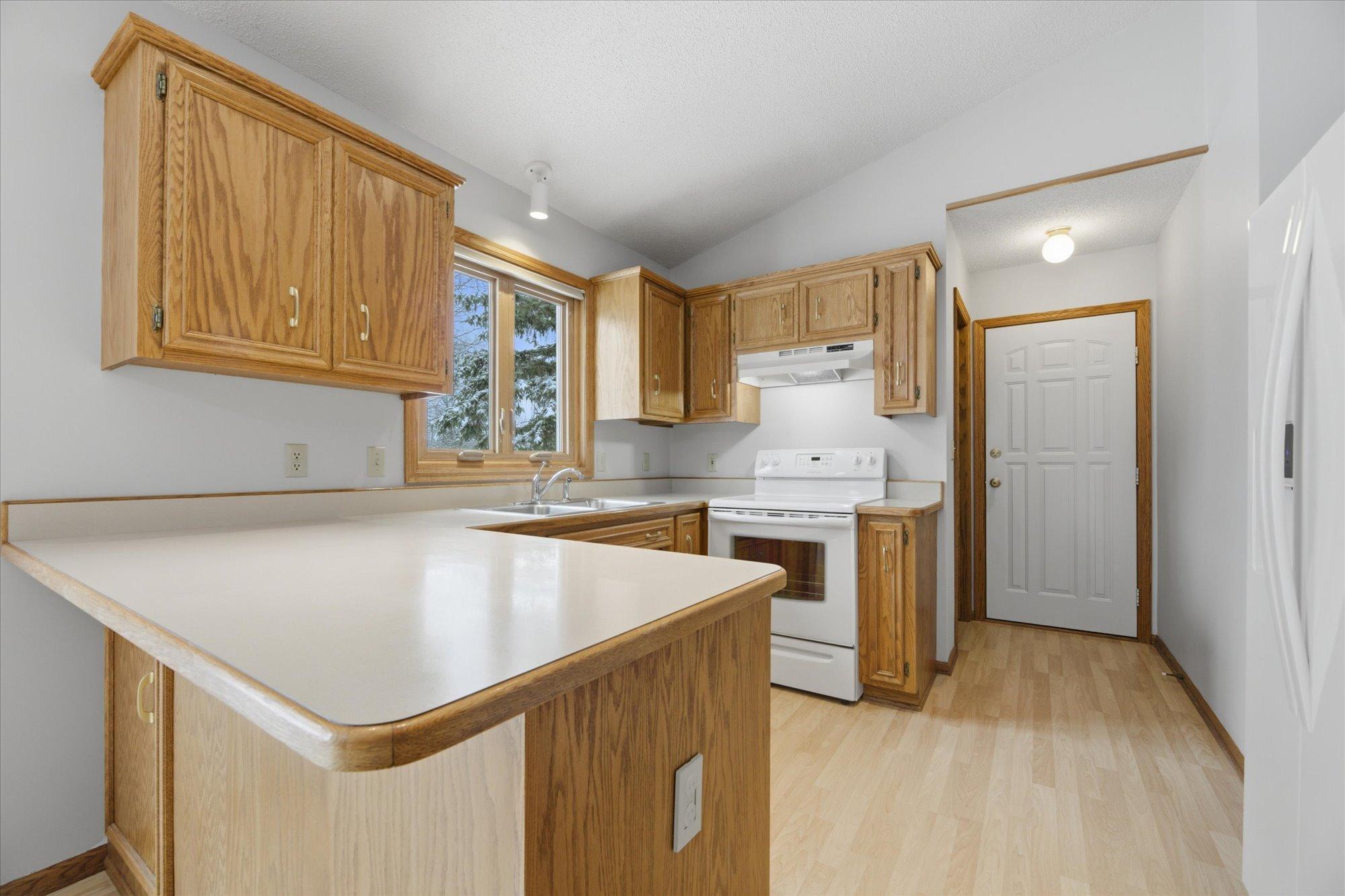 Garage-entry for easy grocery placement in walk-in pantry.