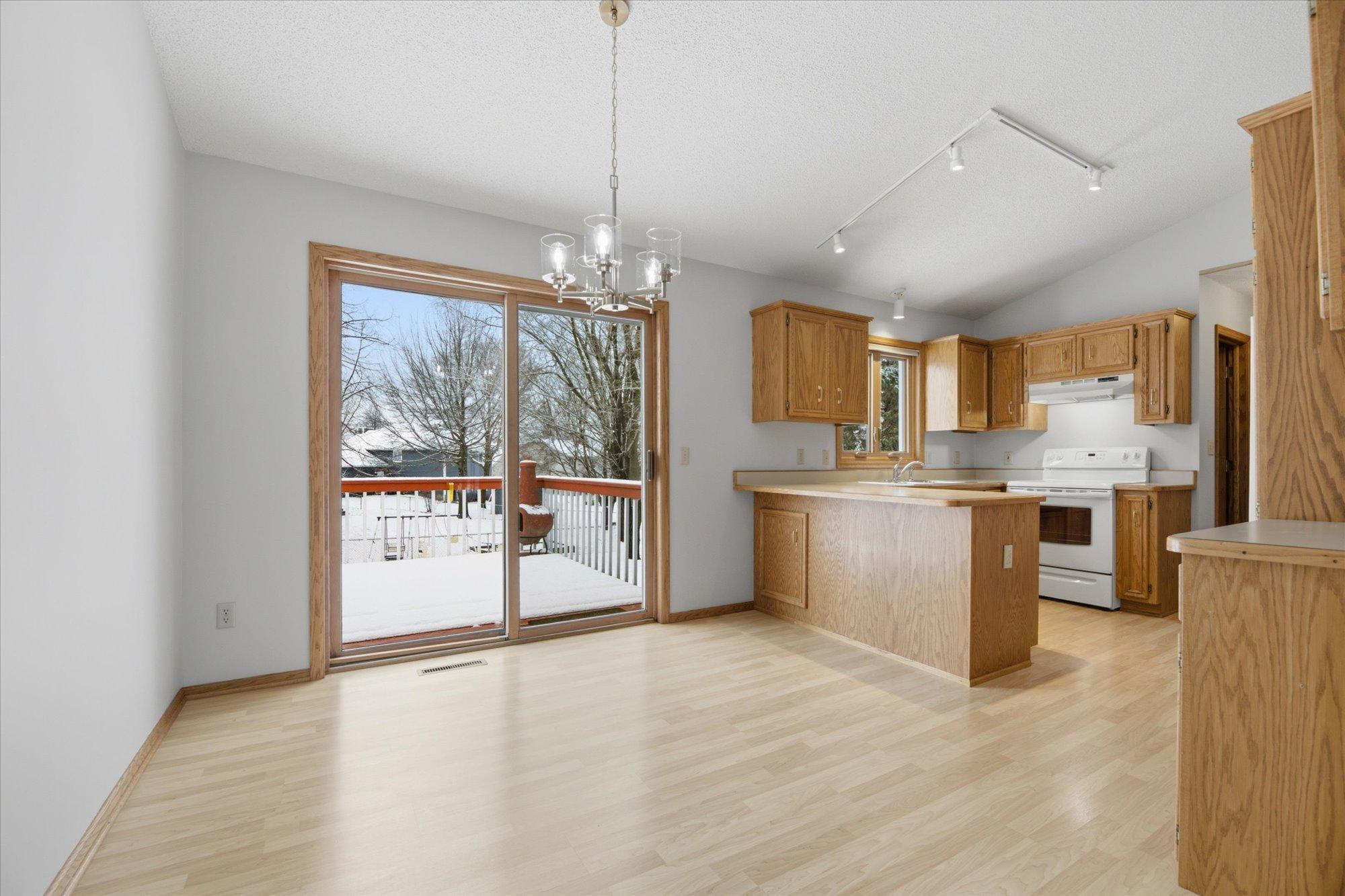 Vault ceilings and patio door to deck.
