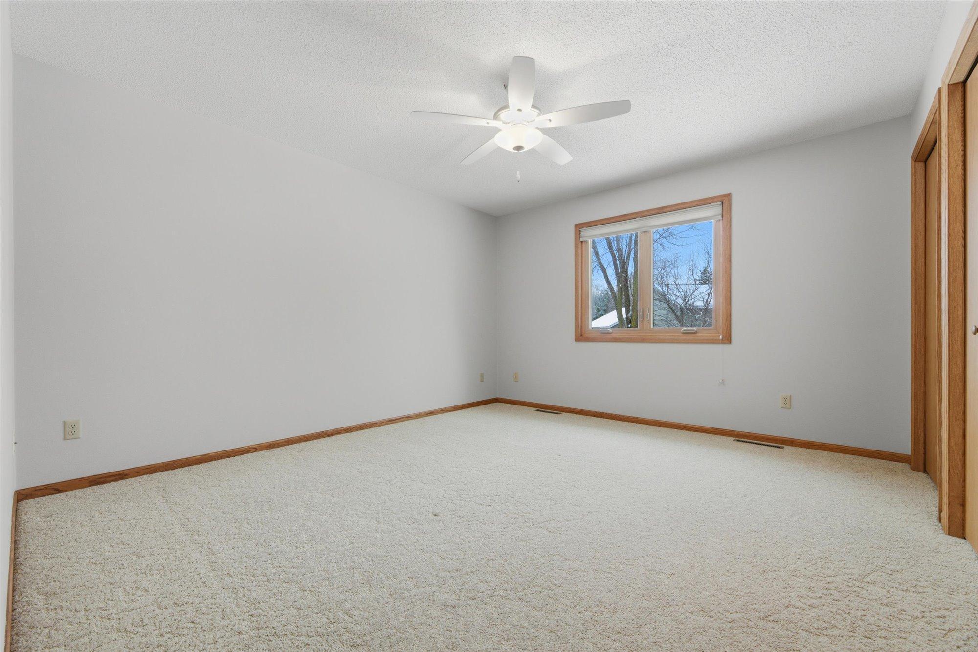 20'x13' Primary Suite with private 3/4 bathroom, dual closets and built-in wardrobe/entertainment cabinet. Window overlooking backyard.