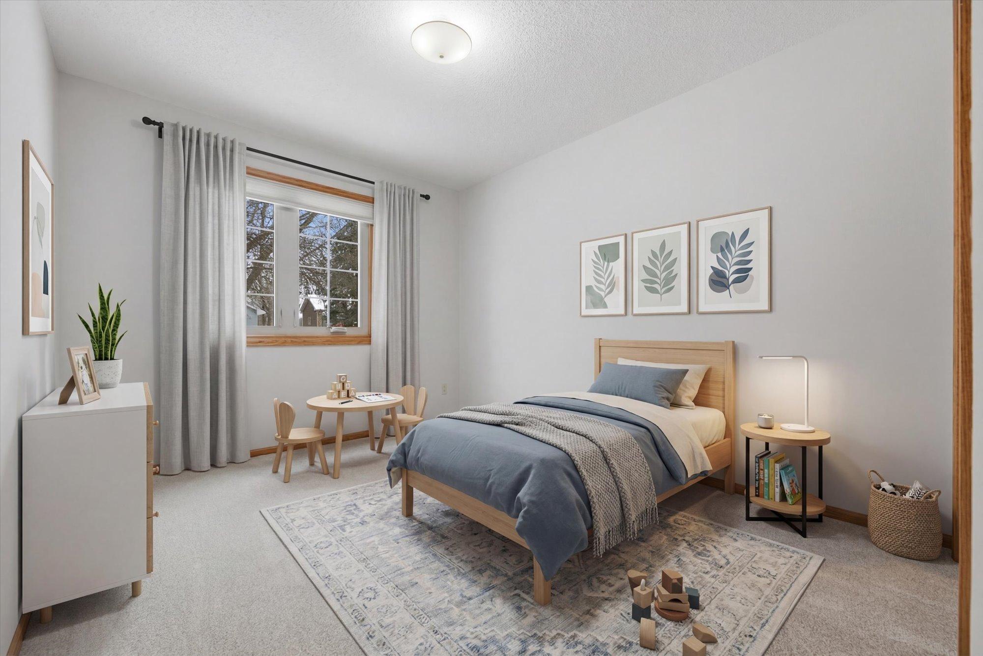 Main level bedroom #2. This photo has been virtually staged.