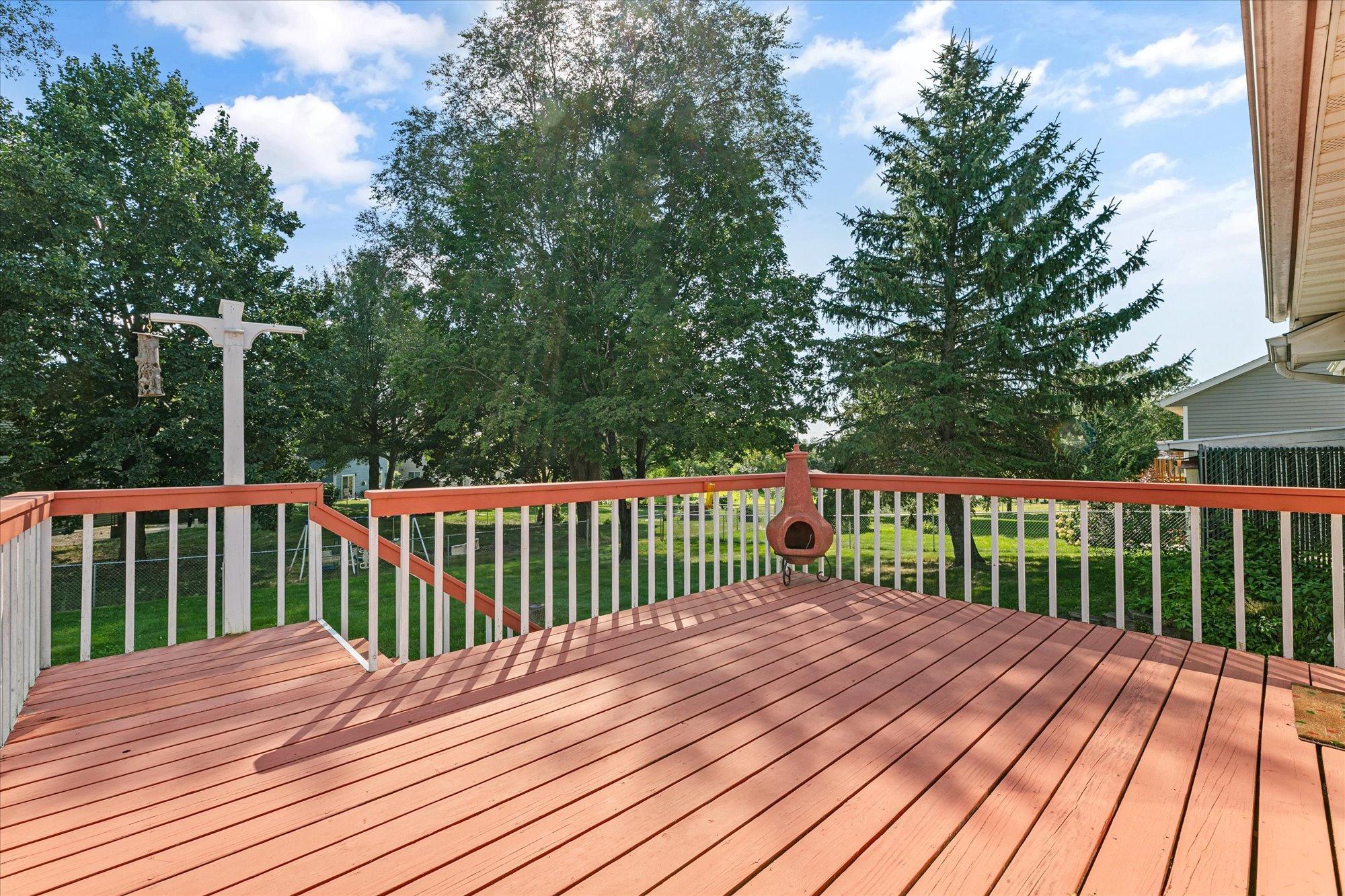 Oversized 15'x15' deck with stairs to the backyard. Cedar plank decking.