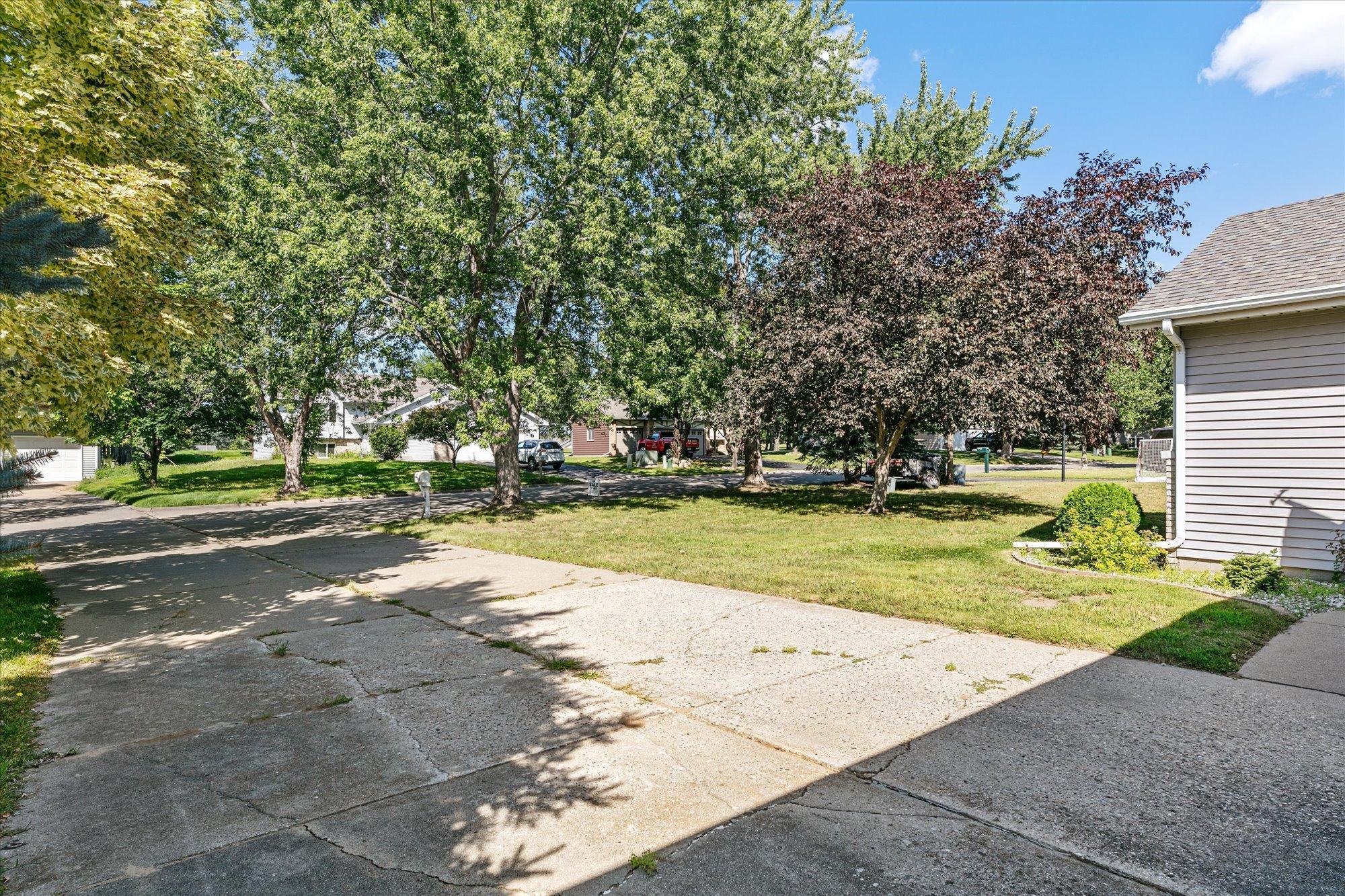 Long concrete driveway for additional cars to conveniently park outside.