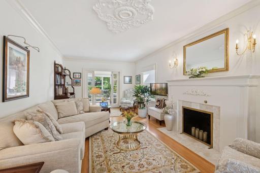 Large formal living room with wood burning fireplace