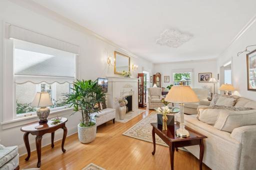 Bright living room, sconce lighting, custom window shades