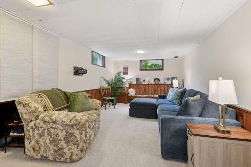 Lower level family room with built-in bench seating/storage