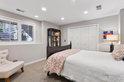 Comfortable lower-level bedroom with ample space for guests, hobbies, or a quiet retreat
