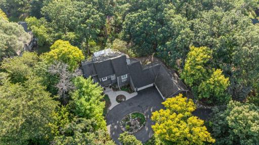 Aerial view showcasing the homeâs private, wooded setting