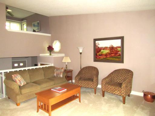 Partial view of the living room. Note the octagon window and shelf for special decor or collectibles.